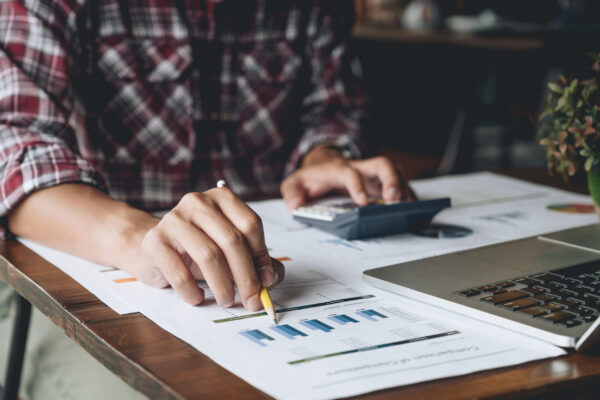 accountant or banker making calculations. Savings, finances and economy business concept