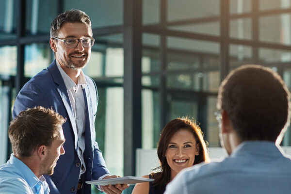 Leader, feedback or business people with tablet for planning, investment research or budget advice. Teamwork, manager and financial advisor in discussion for accounting review, meeting and report