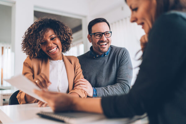 Married couple talking with financial advisor on a meeting